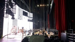 The installation of lighting rigging on the stage at the Colosseum